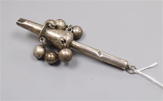 A late 19th century Chinese white metal childs rattle by Tien Shing?, Hong Kong, 11cm.